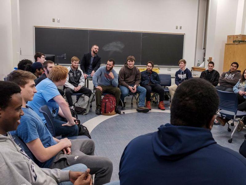 Students sitting in a circle in a classroom